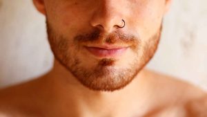 man with black nose ring